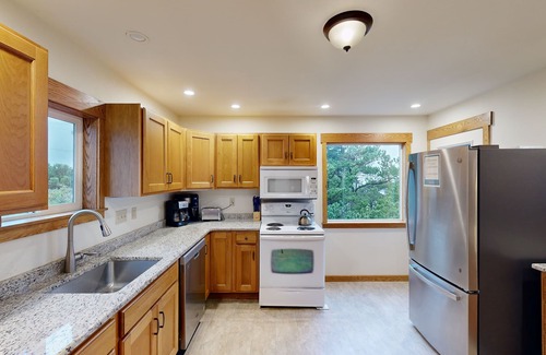 Newport House | Comfy duplex with peekaboo ocean views, private hot tub, & easy beach access
