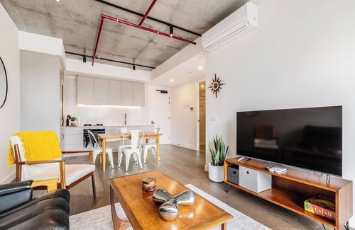 Brunswick Apartment | Concrete Junction Sunny Industrial Balcony Haven
