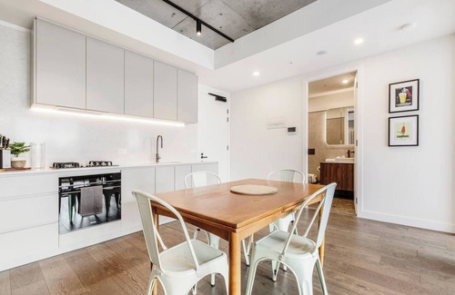 Brunswick Apartment | Concrete Junction Sunny Industrial Balcony Haven