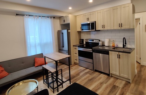 Brantford House | Condo style 2 bed unit on main level with parking