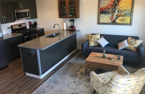 Steel Yards Apartment | Condo with deck facing the mountain, bike path and restaurant across the street, 5 min driving from down town