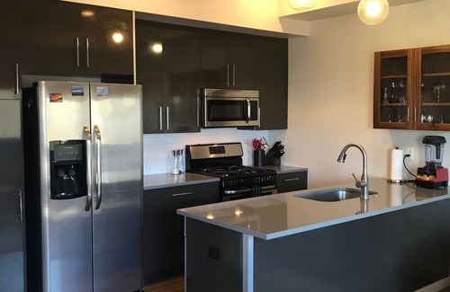 Steel Yards Apartment | Condo with deck facing the mountain, bike path and restaurant across the street, 5 min driving from down town