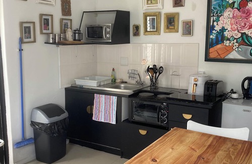 Constantia Cottage | Constantia Lazy River, Froggs Leap studio for 2 people and 2 small kids on sofa