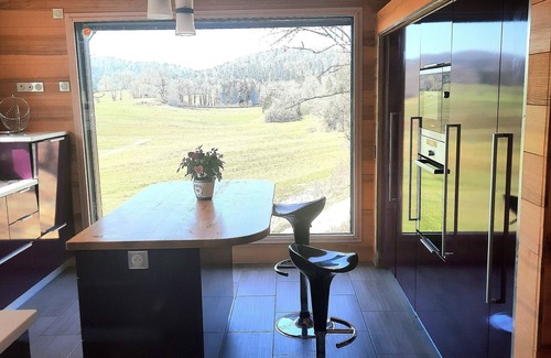 Entre-Deux-Monts House | Contemporary home with jacuzzi overlooking nature