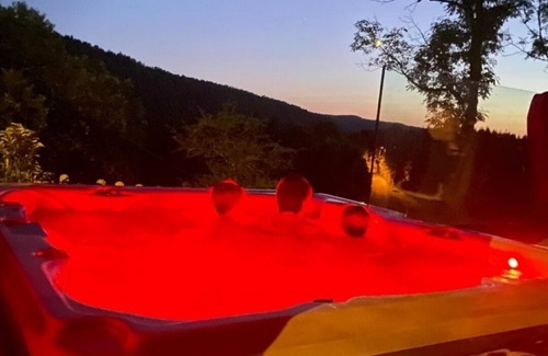 Entre-Deux-Monts House | Contemporary home with jacuzzi overlooking nature