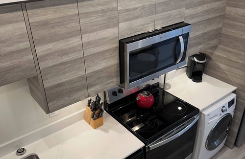 Vernon Condo | Contemporary studio retreat steps to the beach on Okanagan Lake.
