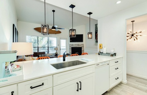 Pirates Cove House | Contemporary Townhome w/Bay View - Cozy Living Area & Gorgeous Sunsets