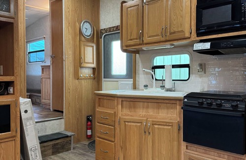 Schoharie RV Rental | Convenient Campsite W/fifth wheel camper, Creek Front.