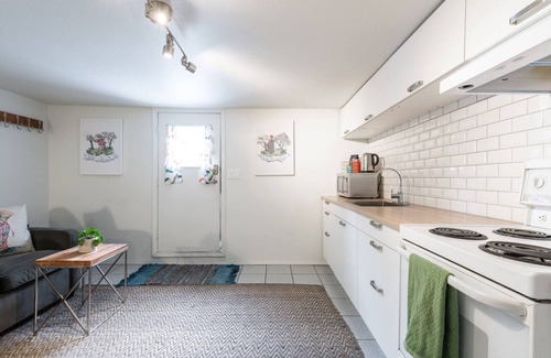 Kensington-Cedar Cottage House | Cool, cozy and modern space with a garden patio to enjoy meals in sunny weather.
