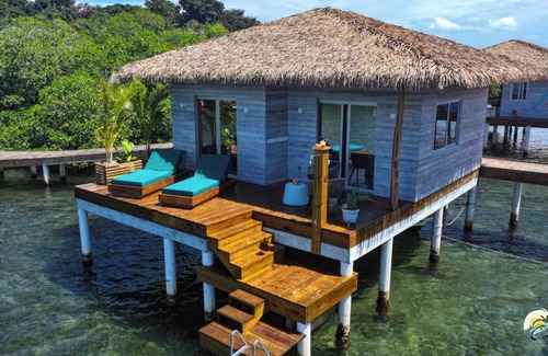 Isla Solarte House | Coral Reef Over Water Bungalow, Bedroom, King Bed, Living Room, Kitchenette