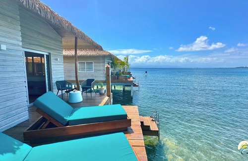 Isla Solarte House | Coral Reef Over Water Bungalow, Bedroom, King Bed, Living Room, Kitchenette