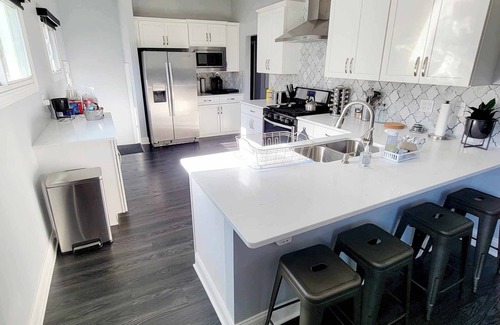 Evansville House | Corner Bungalow: Newly Renovated, Spacious & Open, Central & Convenient.