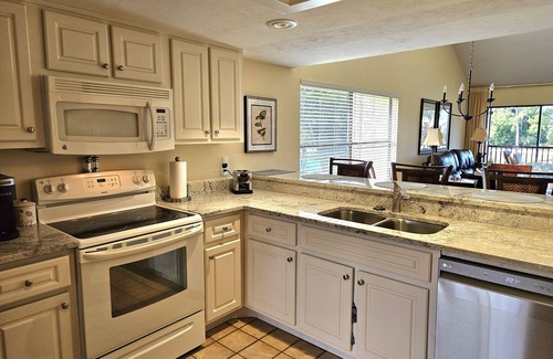 Biggar Condo | Corner condo with golf course views in The Forest