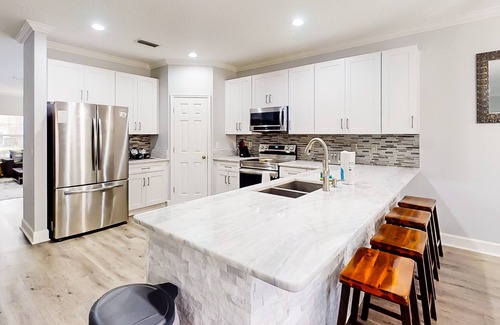 Doctors Inlet House | Corner-lot home with fenced yard, game room, screened lanai, & golf