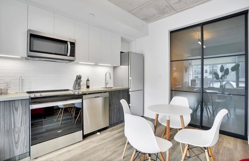 Wellington Village Apartment | Corporate Stays - Modern 1BR Loft with Spacious Layout and Style