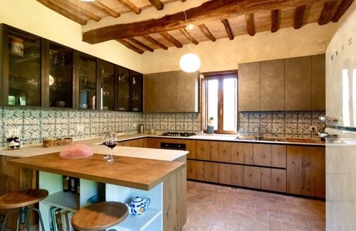 Buonconvento House | Cortile del Pozzo family home sleeps 8 with private garden by Italian Apartments