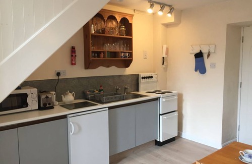 Lostwithiel Cottage | Cosy chapel cottage at Peregrine Hall with pool and walking distance into town
