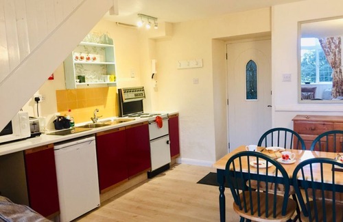 Lostwithiel Cottage | Cosy chapel cottage at Peregrine Hall with pool and walking distance into town