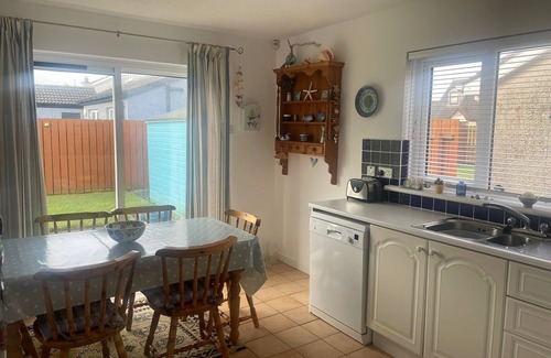 Bushmills House | Cosy coastal bungalow in Portballintrae. Five minute drive to portrush.