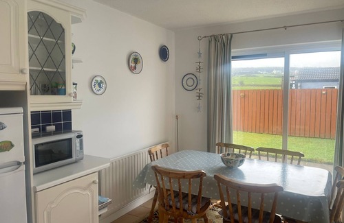 Bushmills House | Cosy coastal bungalow in Portballintrae. Five minute drive to portrush.