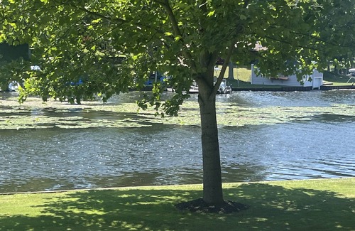 Ludington Cottage | Cottage 1 is a charming 2 bedroom only 25’ from its boat dock & Hamlin lake.