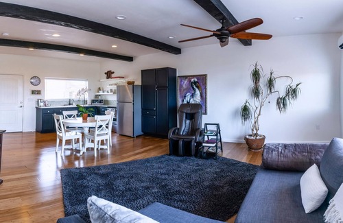 Talent Apartment | Cottage 1 offers a king-sized bed, dining area, full kitchen, hot tub.