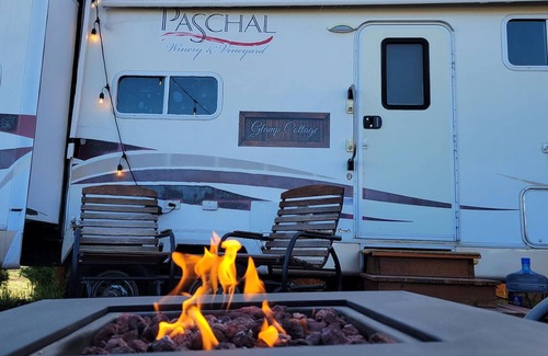 Talent House | Cottage features a queen-sized bed, dining area, and full kitchen.