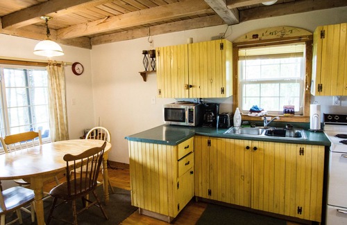 Arrowsic Cottage | Cottage featuring a Screened Porch overlooking the Water