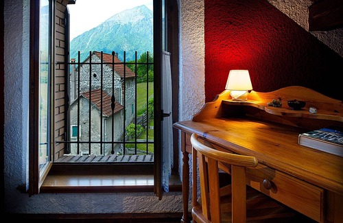 Ponte nelle Alpi Cottage | Cottage in Italy with Alpine Fireplace