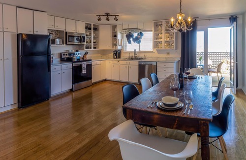 Talent Apartment | Cottage offers a sectional sofa, chef's kitchen and open floor plan.