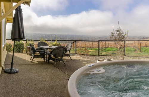 Talent Apartment | Cottage offers a sectional sofa, chef's kitchen and open floor plan.