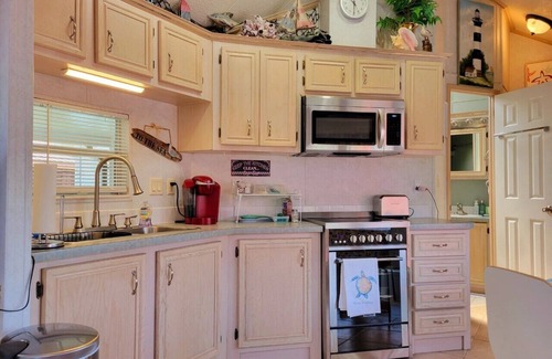 Upper Grand Lagoon House | Cottage on Lake in a Gated Resort Property Near Beaches & Entertainment