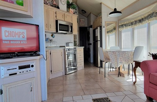 Upper Grand Lagoon House | Cottage on Lake in a Gated Resort Property Near Beaches & Entertainment