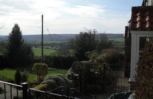 Scawton Cottage | Cottage Sleeps3-fireplace-balcony-garden-mountain