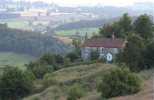 Scawton Cottage | Cottage Sleeps3-fireplace-balcony-garden-mountain