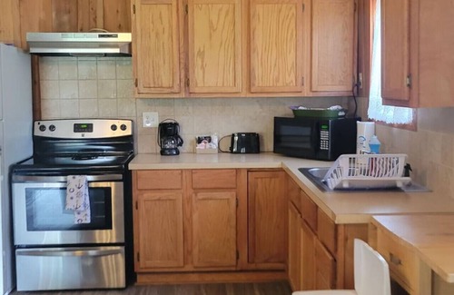 Lake Village Cabin | Cottage tucked in back of orchard with full kitchen and lake access!