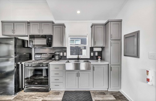 Brenham Cottage | Cottage with Loft - Pet Friendly - Includes 3 queen beds (one in master and 2 in loft), a fully equipped kitchen, dining area, private bath and shower, TVs, Wifi, all utilities, access to all resort amenities. This cottage is pet friendly.