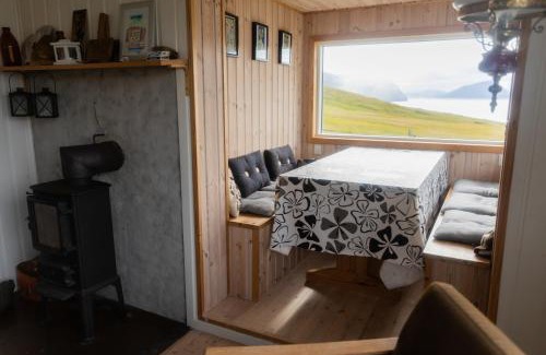 Leynar House | Cottage with stunning view of the sea and islands.