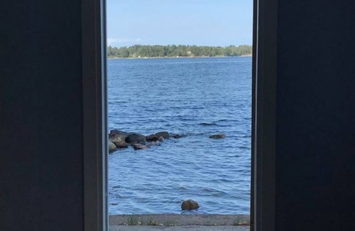 Saltsjo Boo House | Cottage with sunny wooden deck by water