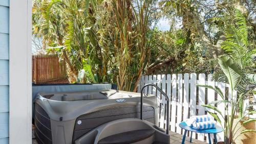 Vilano Beach House | Cottagecore Coast Deck Hot Tub Surf-Centric Neighborhood Kids Suite