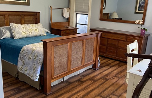 Hunt Club Bed & Breakfast | Country Garden Room with Water Garden feature and Queen Bed.