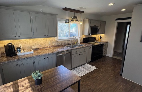 St. Anthony House | Country living house 5 min to sand dunes with large patio, hot tub, and fire pit