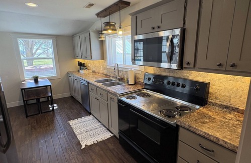 St. Anthony House | Country living house 5 min to sand dunes with large patio, hot tub, and fire pit