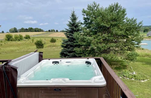 Green Lake House | Countryside oasis w/private beach, swimming pond, hot tub