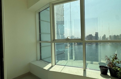 Al Majaz Apartment | Cozy 2-bedroom apartment in superb Sharjah corniche with WiFi, fitness room pool