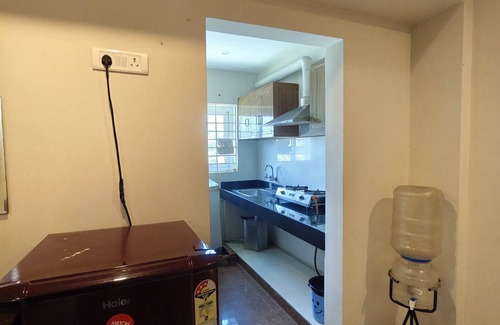 Koyambedu Apartment | Cozy 2-bedroom apartment with AC,Furnished Living space & Fully Equipped Kitchen