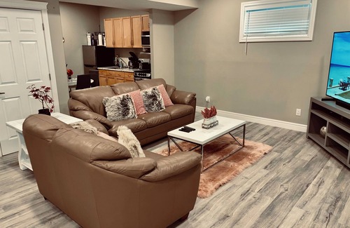 Northwest Edmonton House | Cozy 2 bedroom basement with 2 beds, kitchen, 75’ TV and bathroom