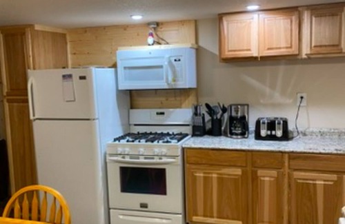 Rudyard Cabin | Cozy 2-bedroom cabin near endless trails. Family and pet friendly. Fire pit & AC