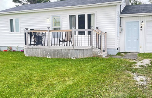 Cow Head House | Cozy 2 bedroom located in Gros Morne, Shallow Bay Beach. Admiring sunsets