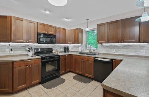 Mosinee Apartment | Cozy 2-Bedroom Retreat with Wooded Views, Fire Pit & Stylish Kitchen!